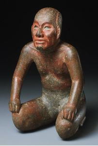Kneeling lord with incised toad on his head