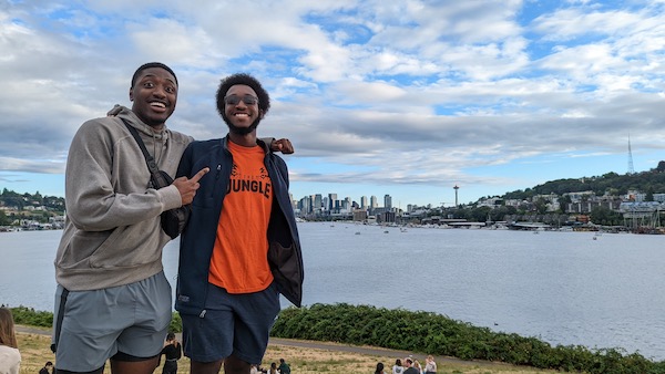 Two friends in front of a lake in Seattle