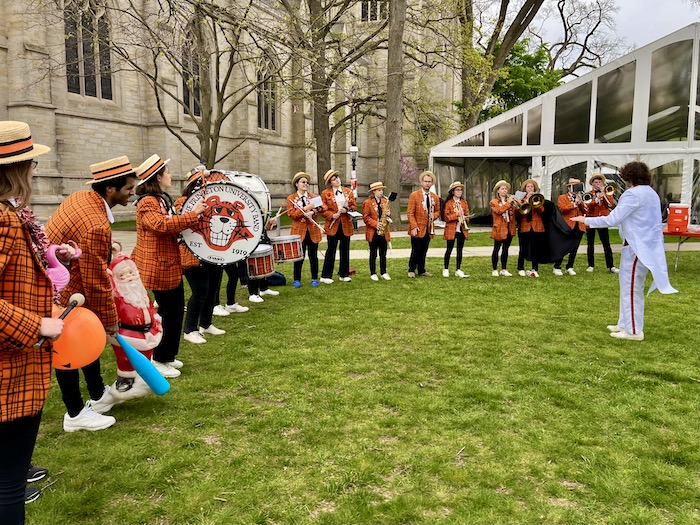 Around 20 members of the Princeton Band playing outside Princeton chapel