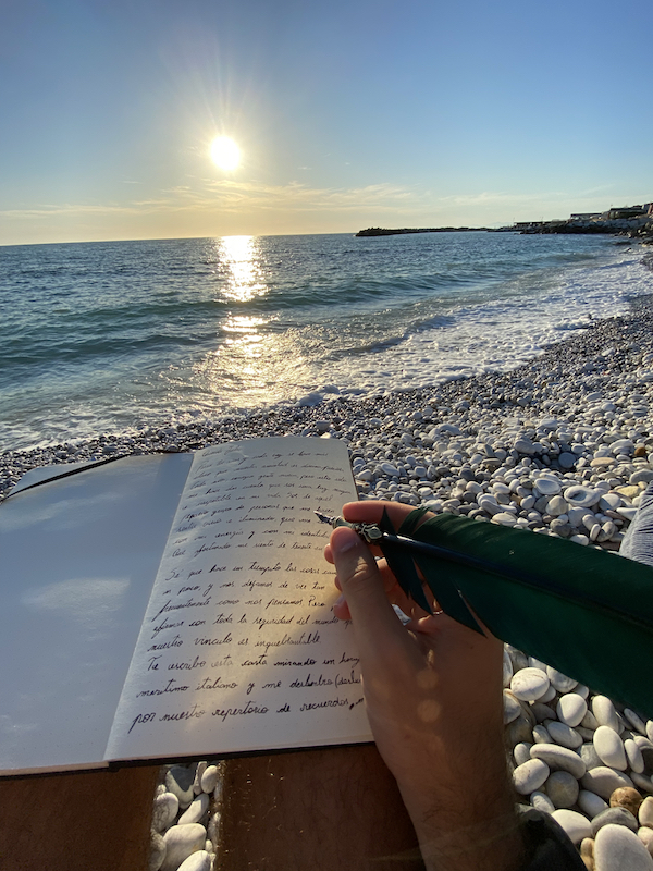 Hand writing over the sea