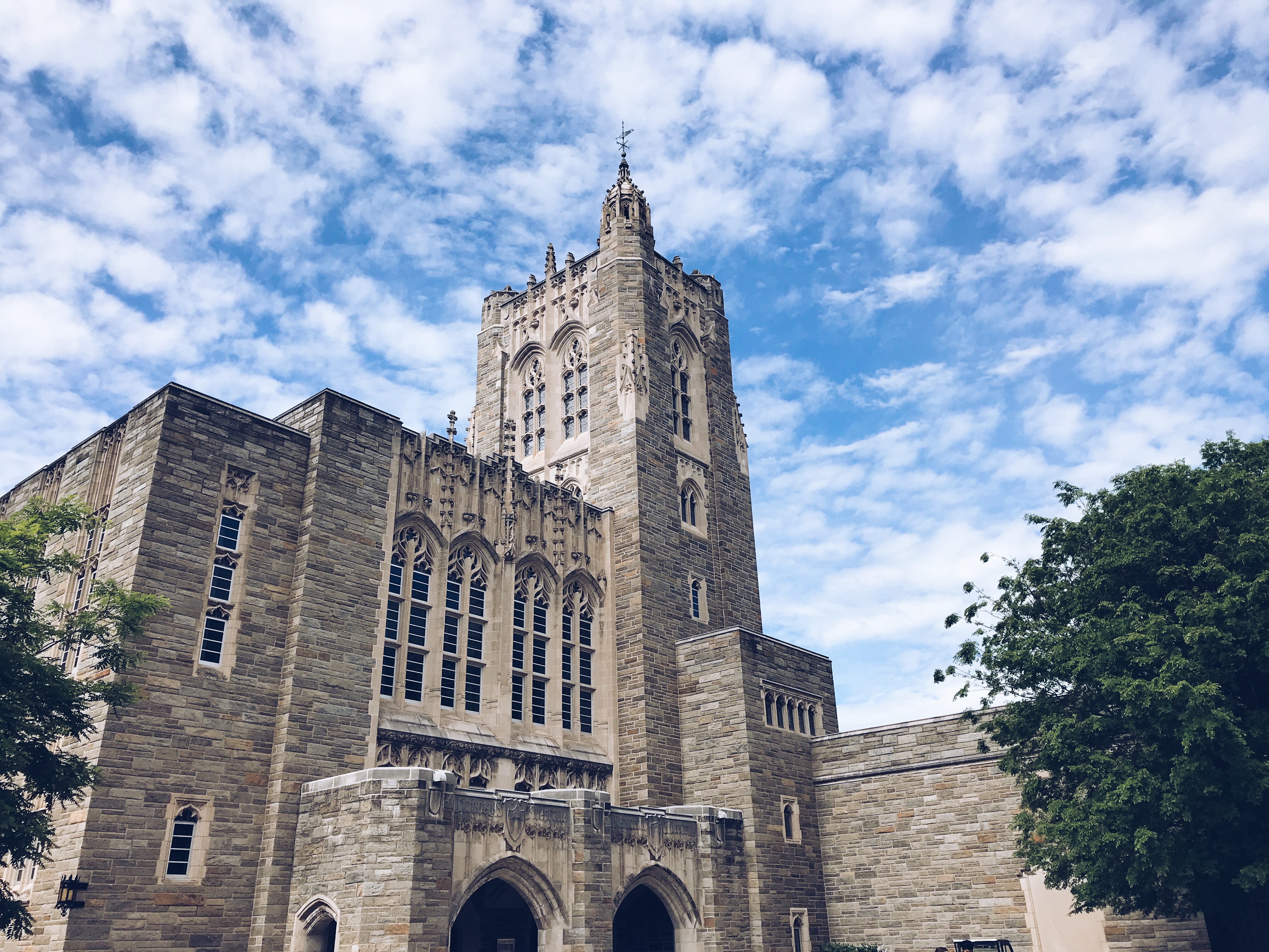 Exterior image of Firestone Library, blue sky with clouds