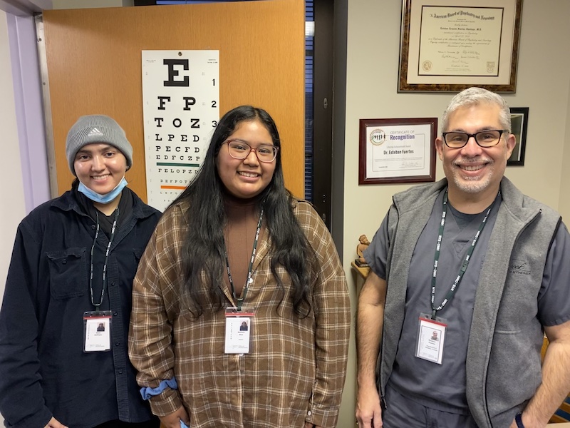 Two Princeton students and a psychiatrist smiling for a photo. 