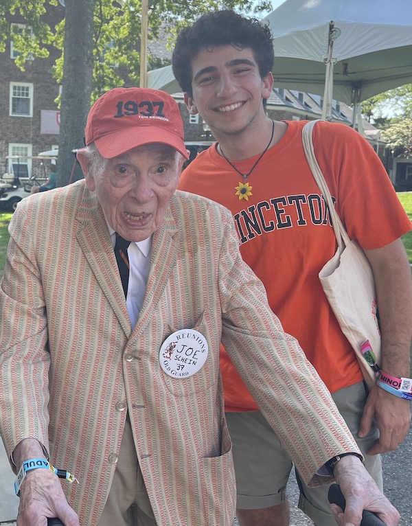 Joe Schein '37 wearing a Princeton blazer poses with Ian Fridman '25 wearing a Princeton t-shirt