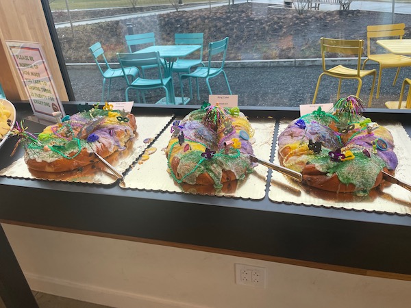 Three Mardi Gras king cakes on counter top