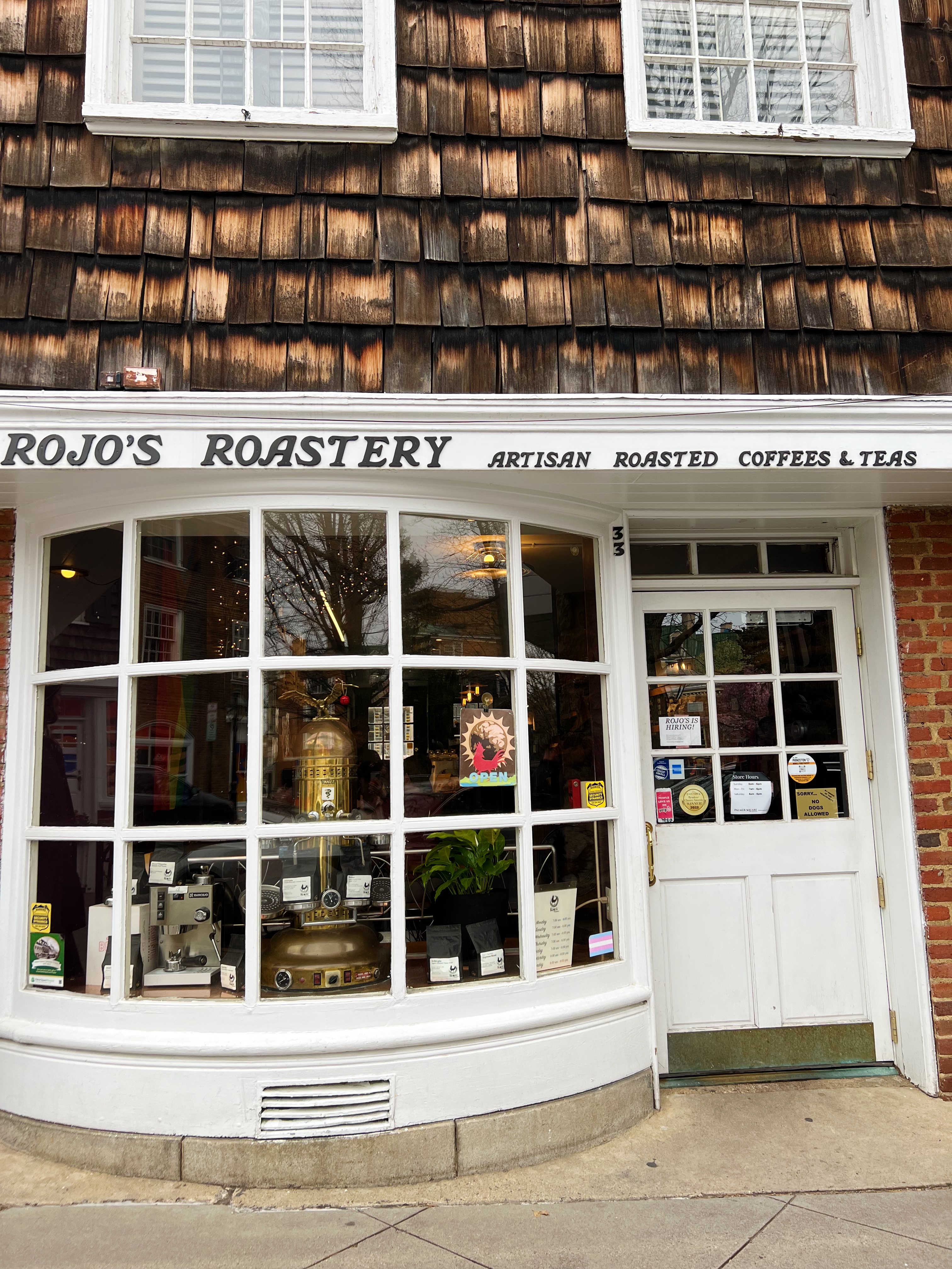 Exterior of Rojo's Coffee, shingled building with a rounded bay window