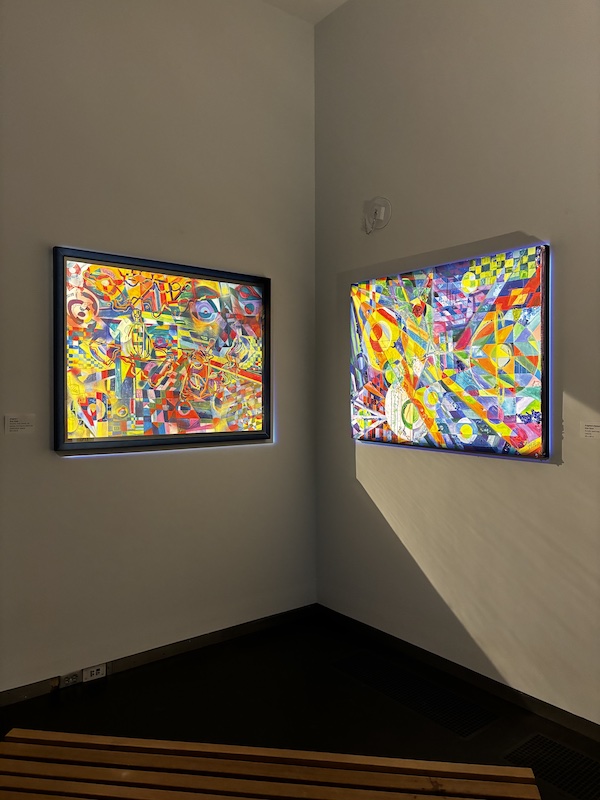 Two abstract paintings on a wall