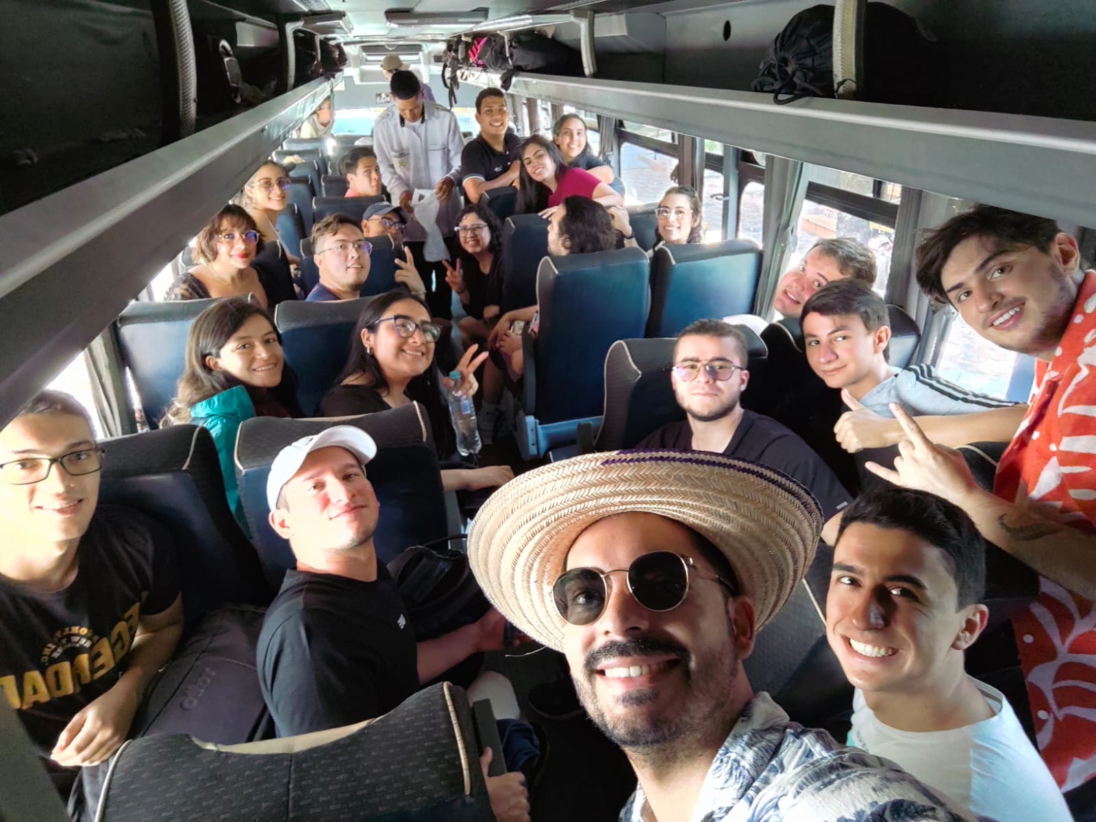 Large group selfie on a coach bus