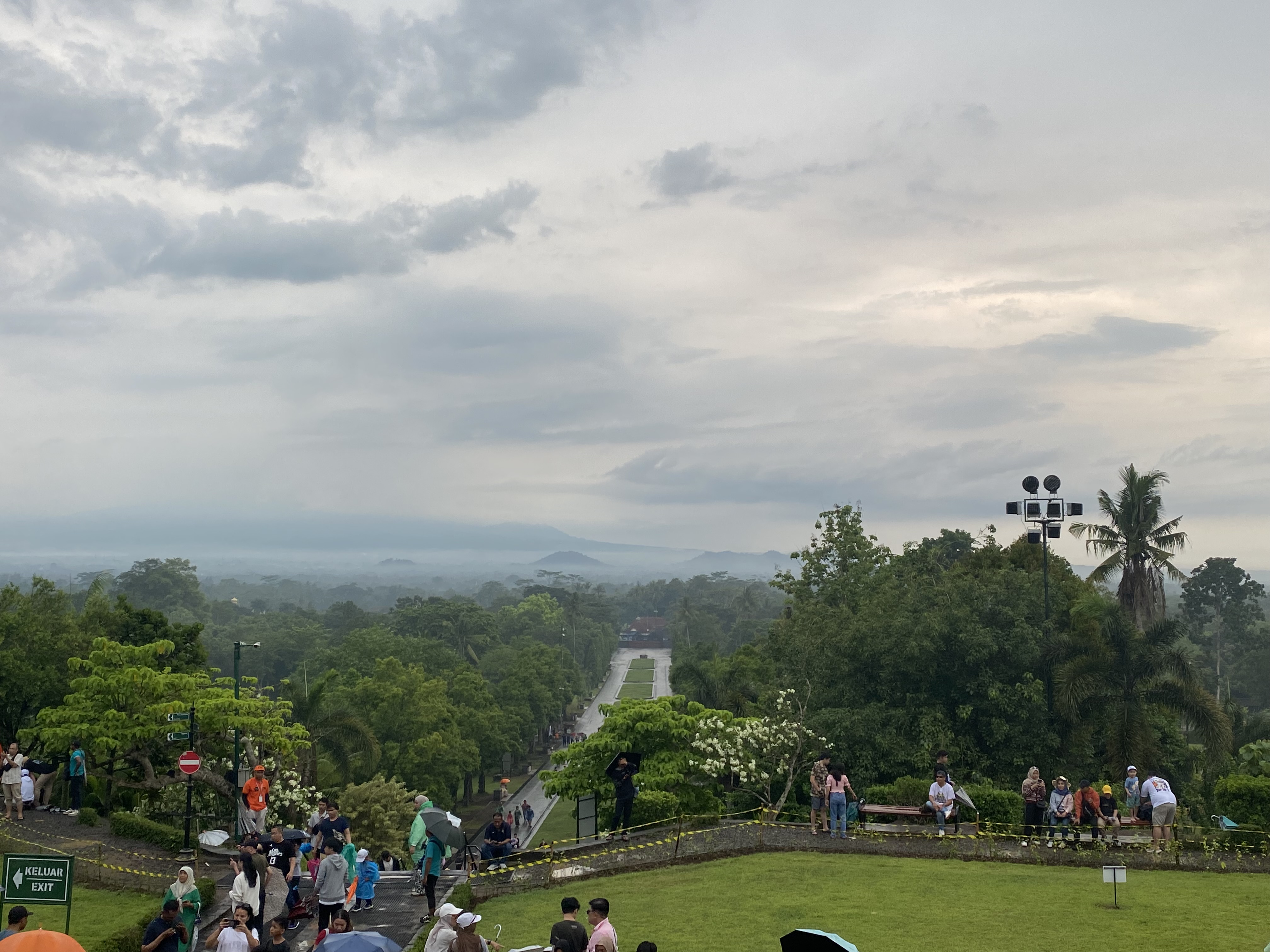 Looking down on the path up to Borobudur Temple, visitors are visible.