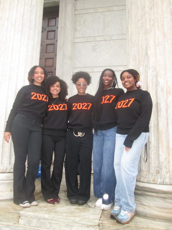 5 girls posing between columns, wearing Class of 2027 shirts