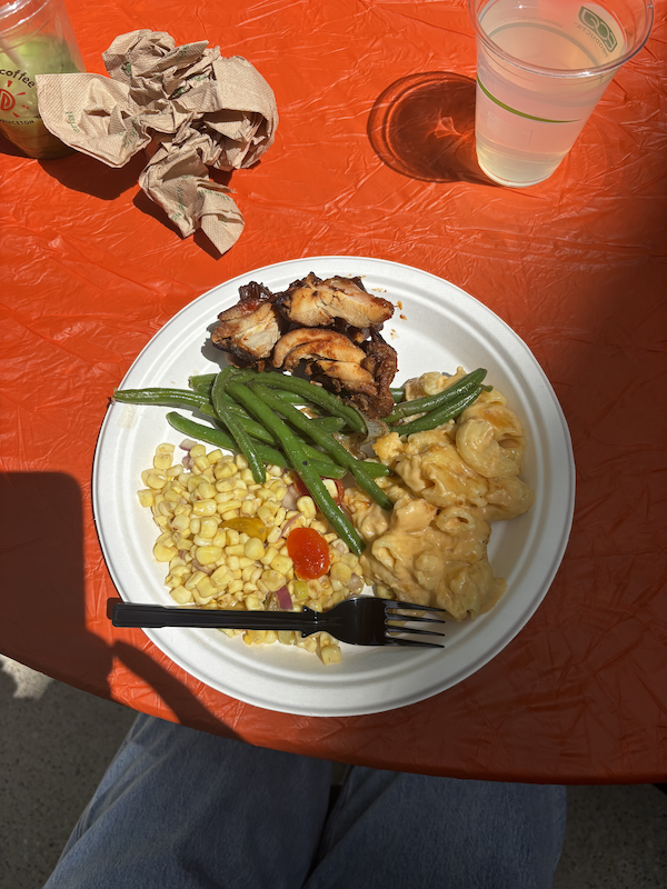 A plate of Mac and Cheese, green beans, and chicken