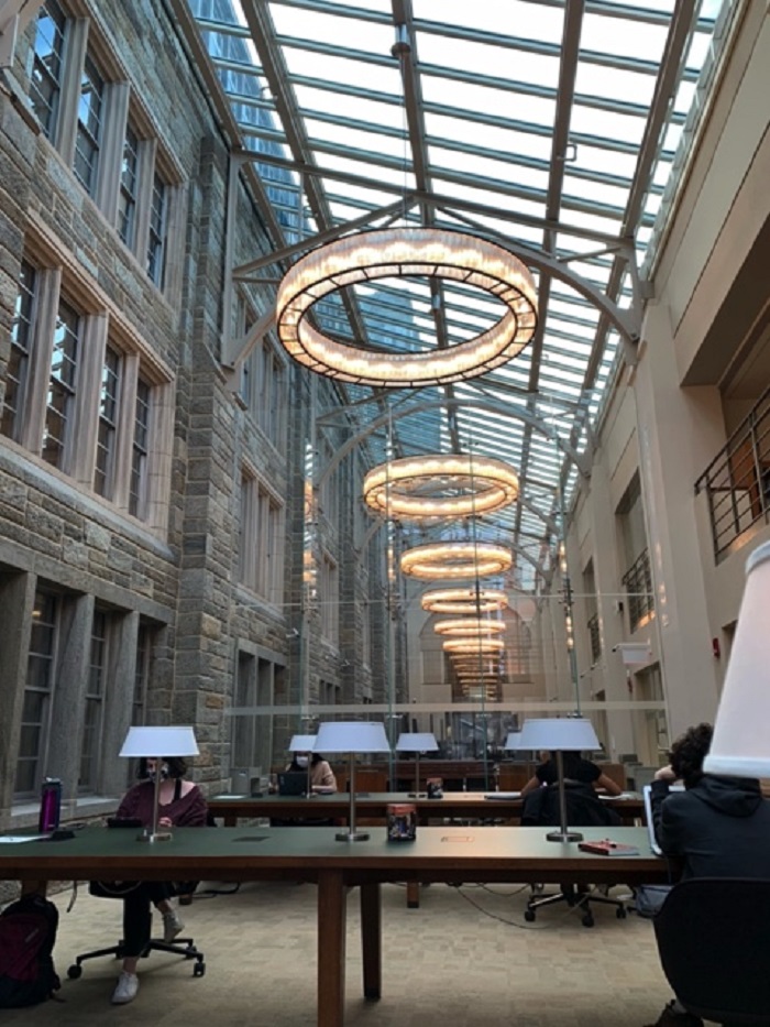 Atrium of Firestone Library with long tables and bright lights