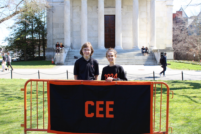 author and friend in front of CEE banner