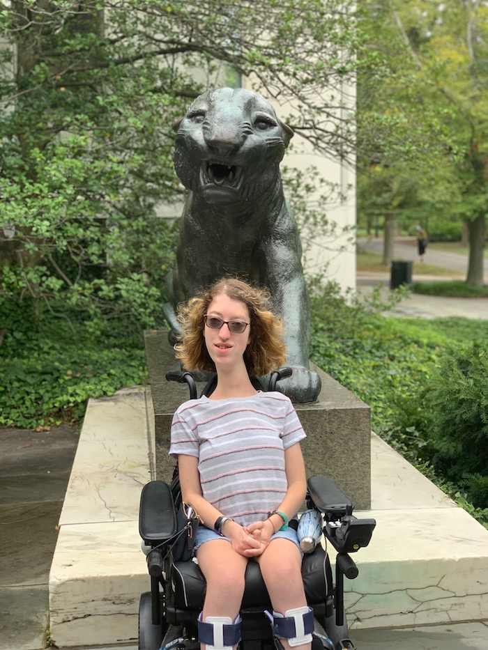 Naomi in front of metal tiger statue