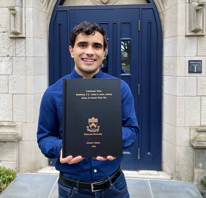 Rob standing with his bound senior thesis