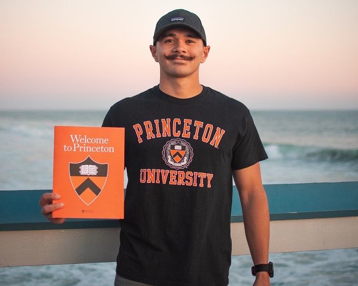 Xander DeLosReyes '23 with Princeton admit packet