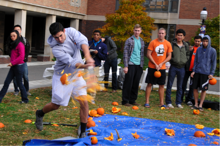 Student smashing pumpkin 