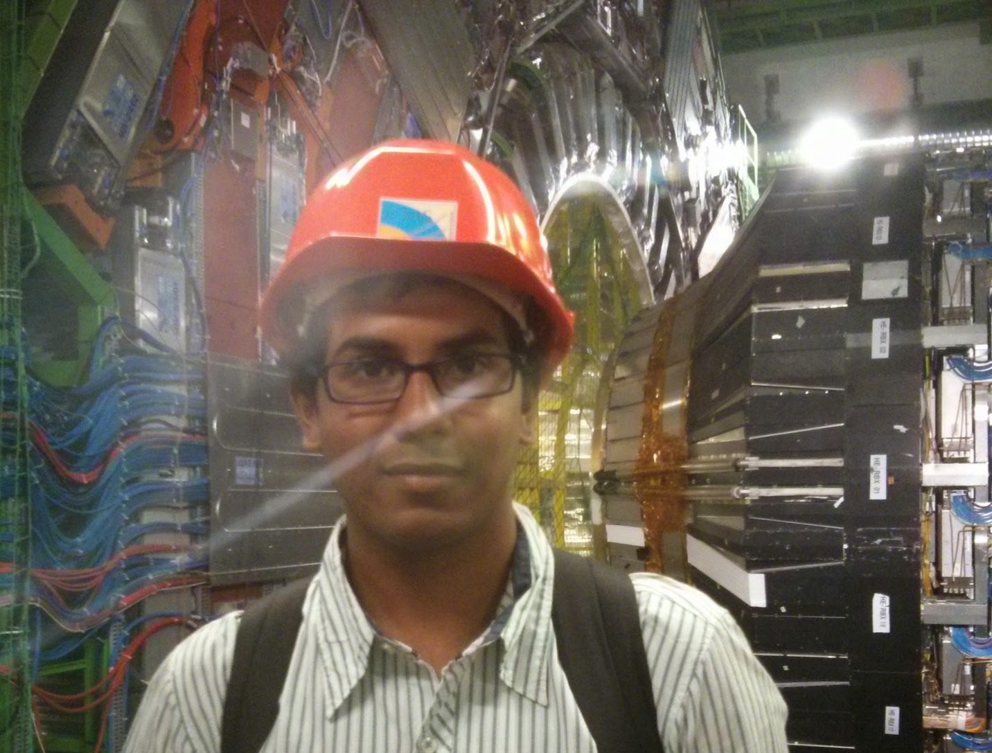 Me standing in front of the Compact Muon Solenoid