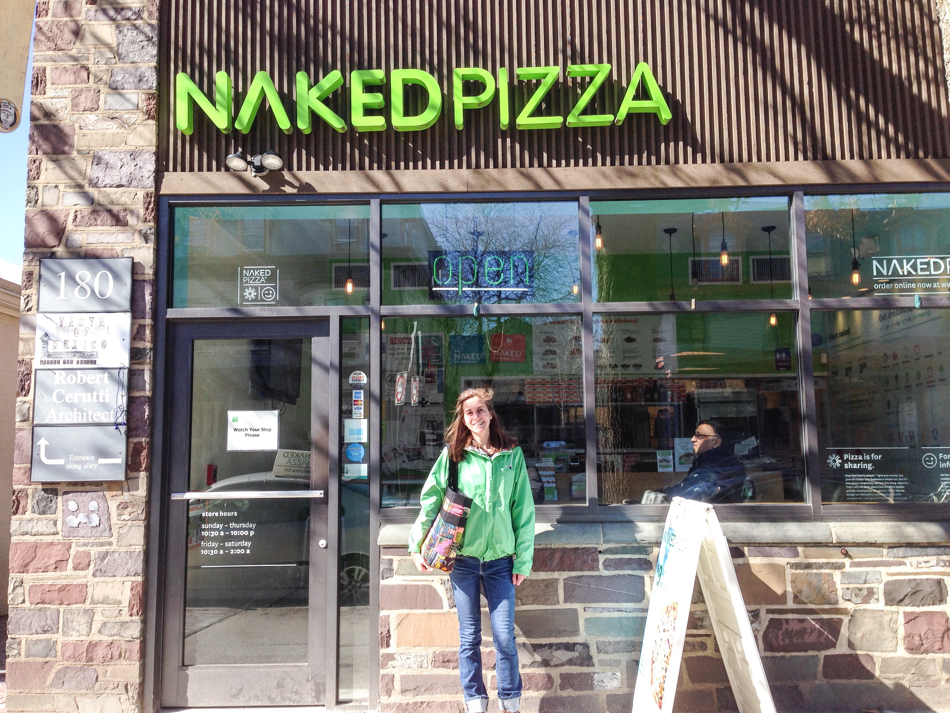 This is a picture of me outside of Naked Pizza.