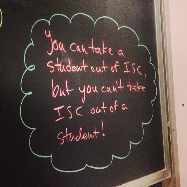 Text on blackboard: "You can take a student out of ISC, but you can't take ISC out 