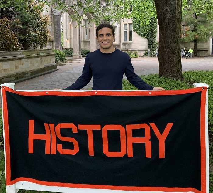 Rob standing behind the History concentration banner