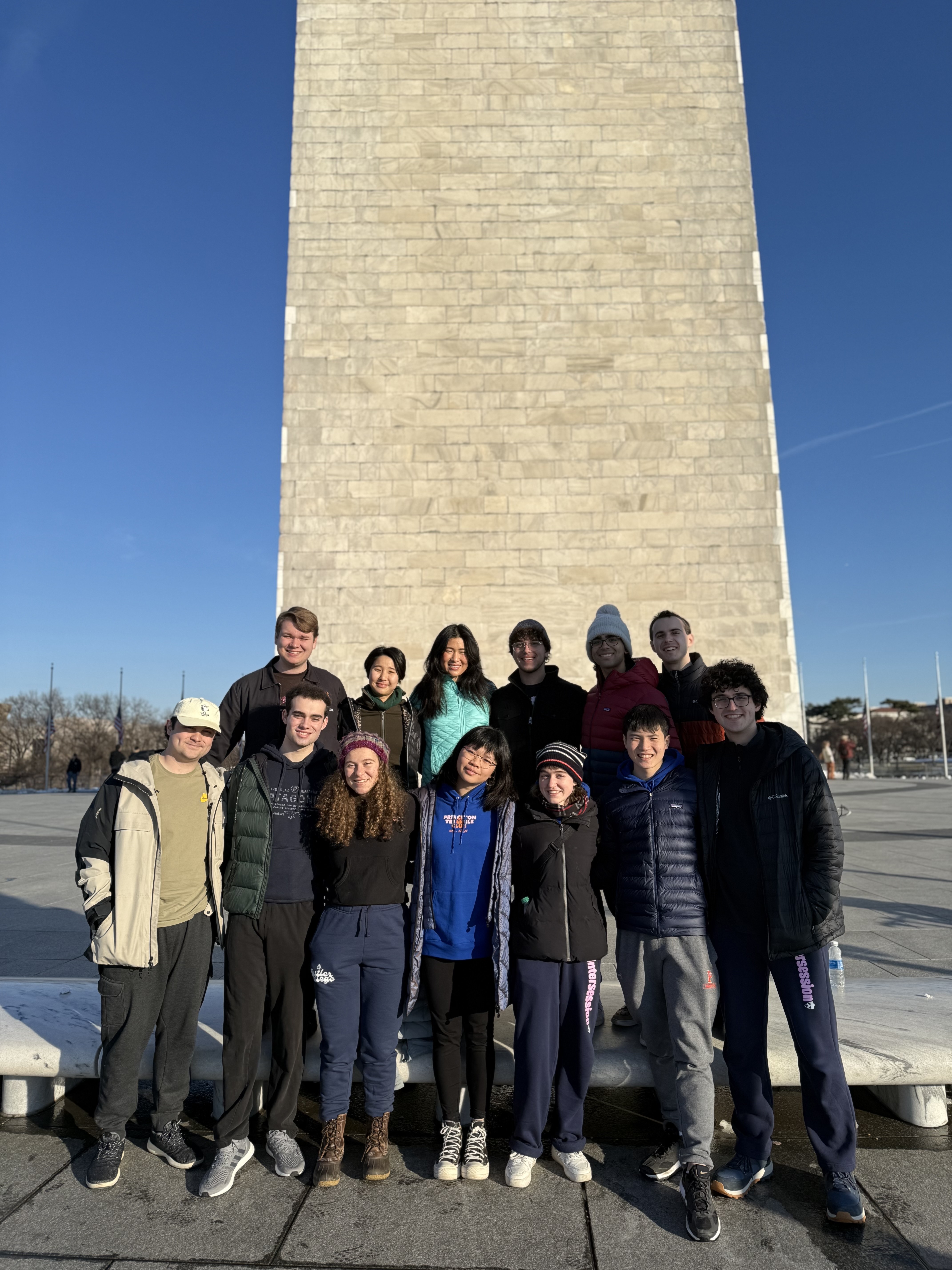 Group of students in front of a monument.