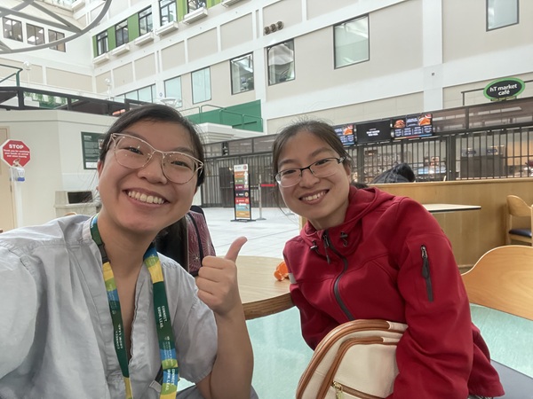 Two people sitting in a hospital cafeteria