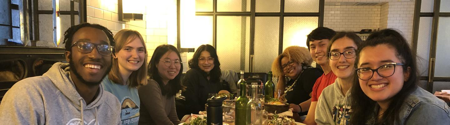 Gil with friends at a restaurant.