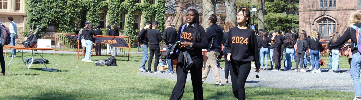 Students walking on Cannon Green in 2024 sweaters